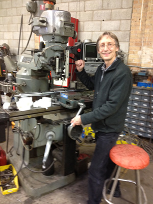 Photo of AMT salesman Bill Cichon at an old Bridgeport milling machine