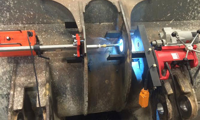 Photo shows our Bore Welder on the left and our Line Boring Equipment on the right side