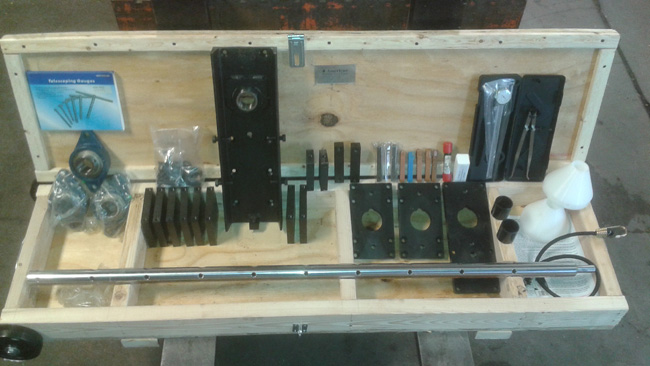 Photo of American Machine Tools Q150-L Portable Line Boring Bar and Equipment in transport box with dolly wheels.