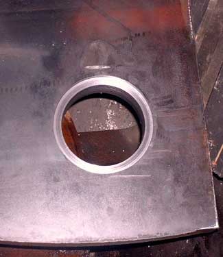 Picture shows what was a rough torch cut hole turned into a finished 6 inch diameter hole.