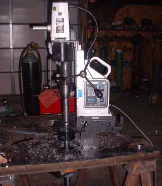 Photo shows the Q150S attached to a customers mag drill turning a torch cut hole into a finished 6 inch diameter hole.