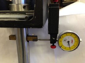 Image of Dial Indicator with Magnet being used to set cutter height 