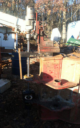 Photo shows a very old magnetic drill press driving the Q150 equipment