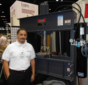 Photo of Oscar standing in front of a Dake 50 ton Hydraulic Shop Press